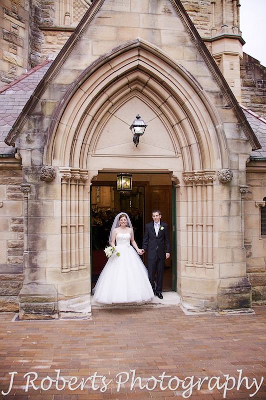 Bride and groom on the church steps at St Thomas' North Sydney - wedding photography sydney